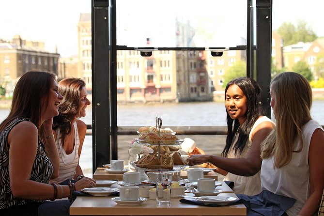 Afternoon Tea River Cruise on the Thames - Tea service with sandwiches, scones, and cakes