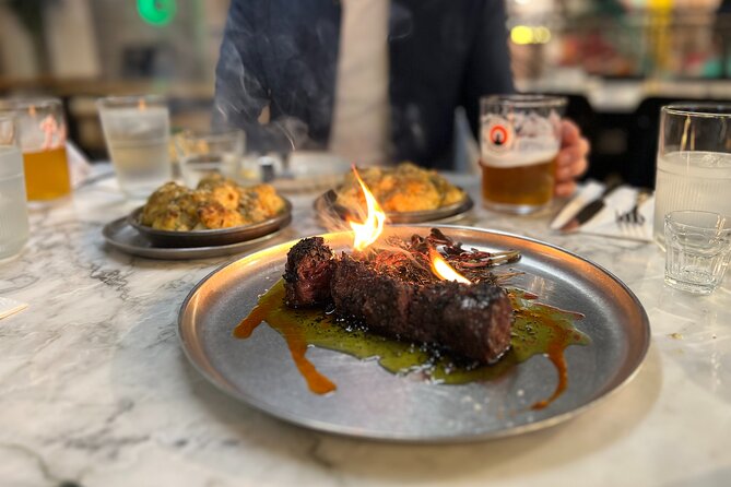 Camden Market Food Tour of 7 Tastings, Gin, Street Food & More - Cyberdog and the Amy Winehouse statue add local character
