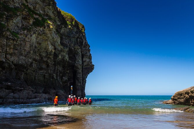 Coasteering Adventures in Bossiney Cove, Bude, and Cornwall - Swimming through arches and sea caves