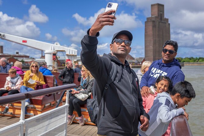 Liverpool: River Cruise & Sightseeing Bus Tour - Cains Brewery Village leads toward the Baltic area