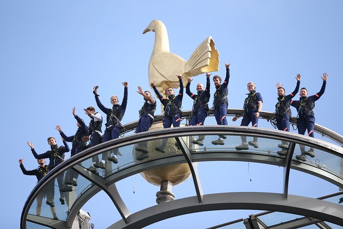 The Dare Skywalk Climb - Crossing the glass walkway toward the golden cockerel