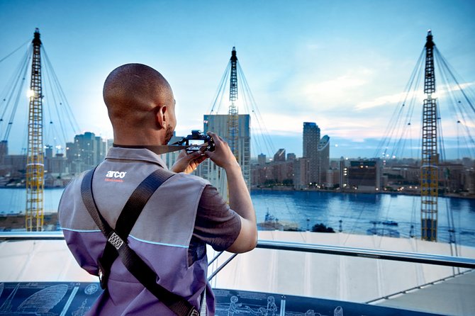 Up at The O2: Daytime Climb with Guided Tour with Panoramic Views - Reaching the summit above the arena